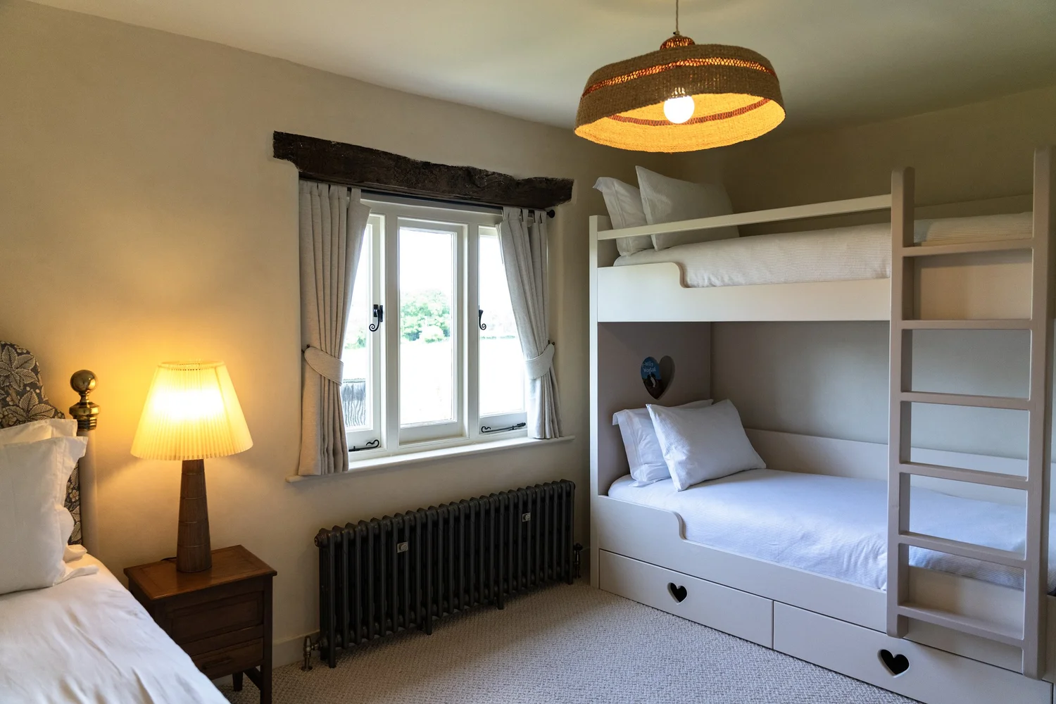 Bedroom three with twin beds and original fireplace