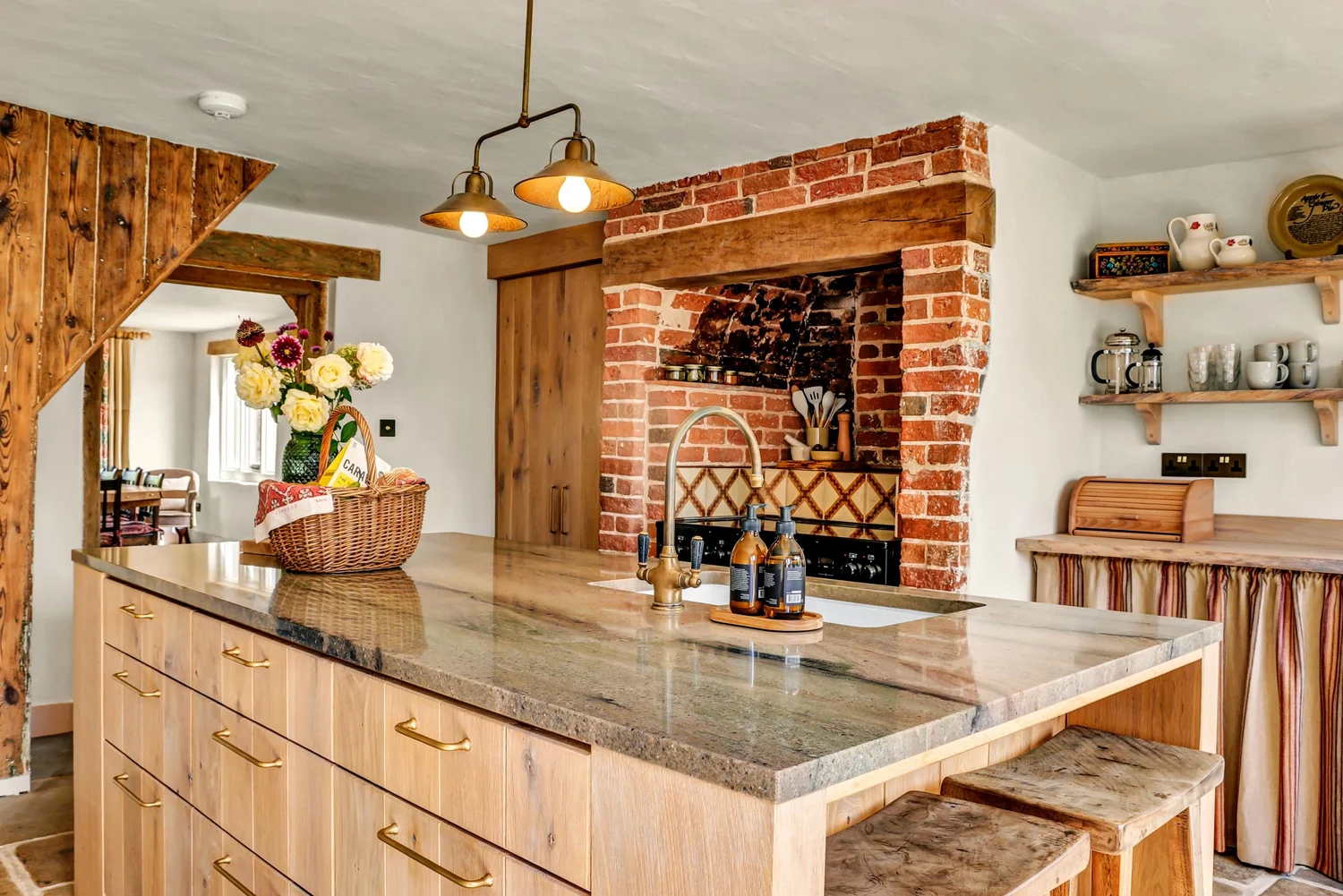 The snug with lime-plastered walls and exposed brick